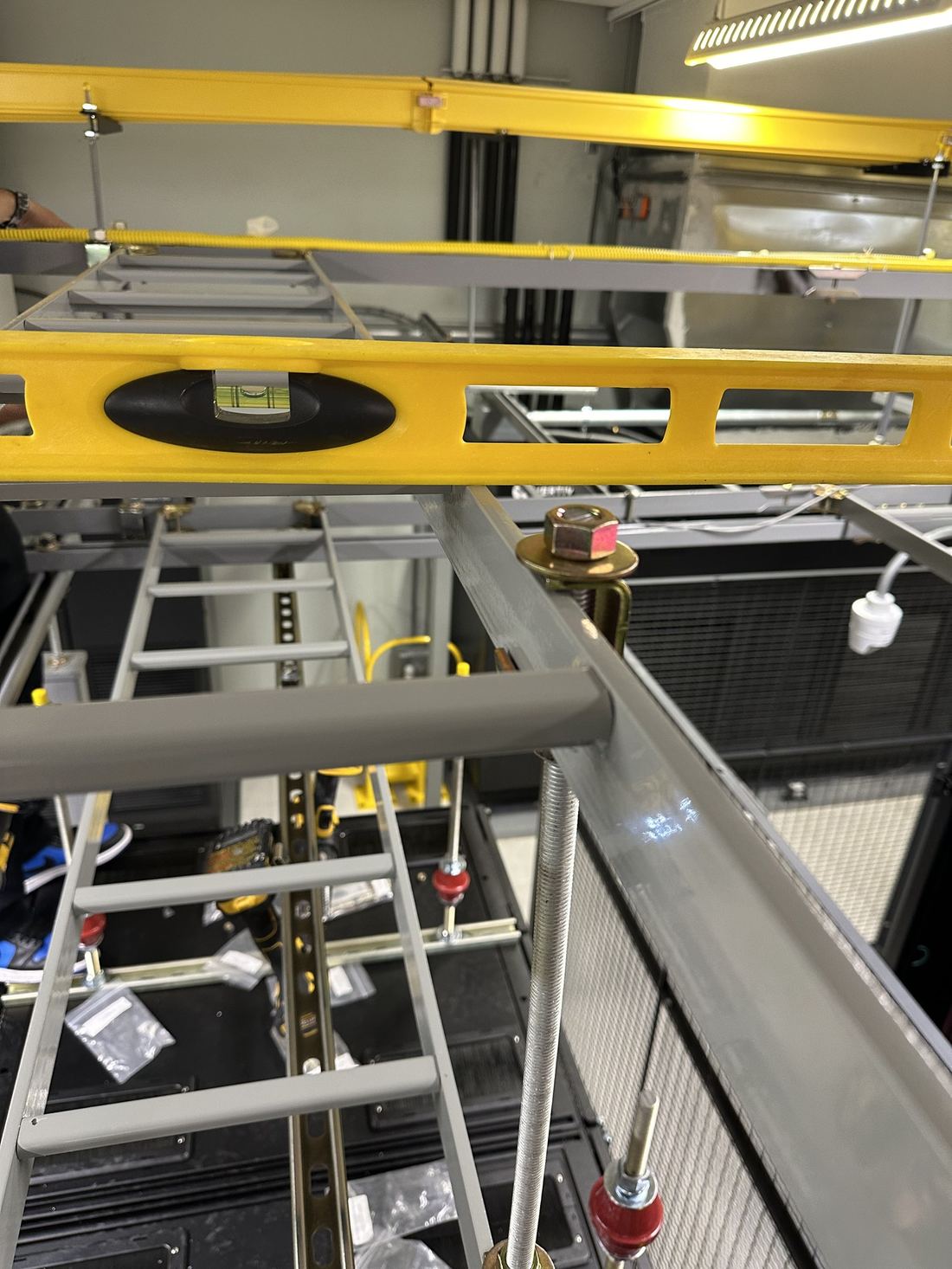 Level check on cable ladder rack before final anchoring