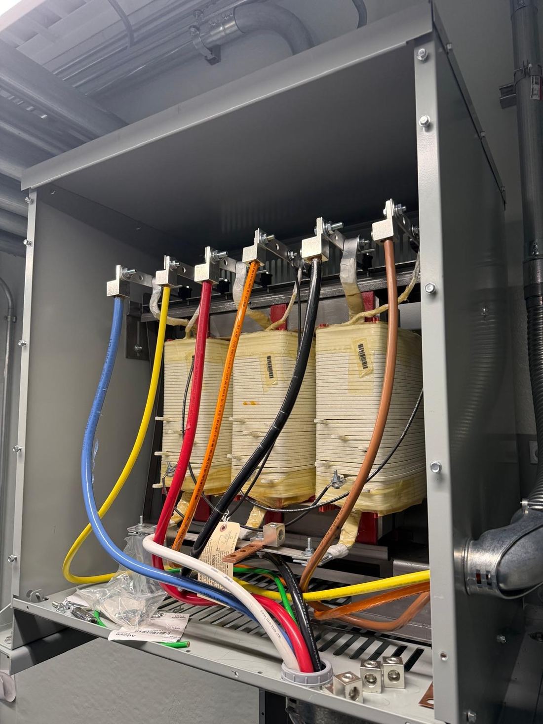 Dry-type transformer internal wiring with identified phase terminals