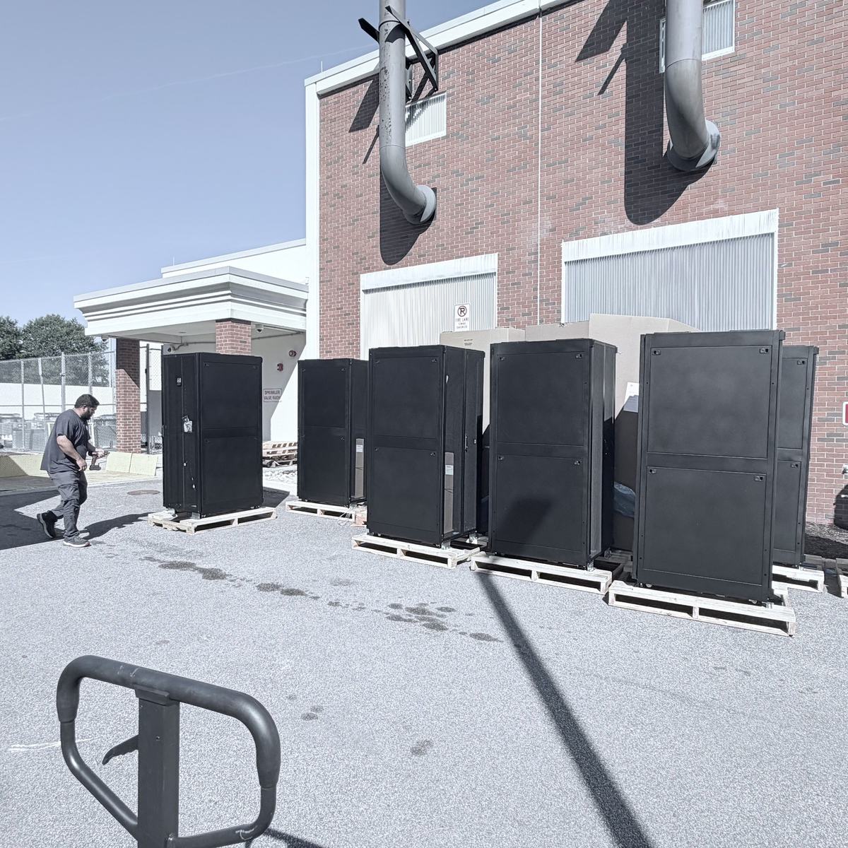 Cabinets on pallets staged outside a facility for delivery