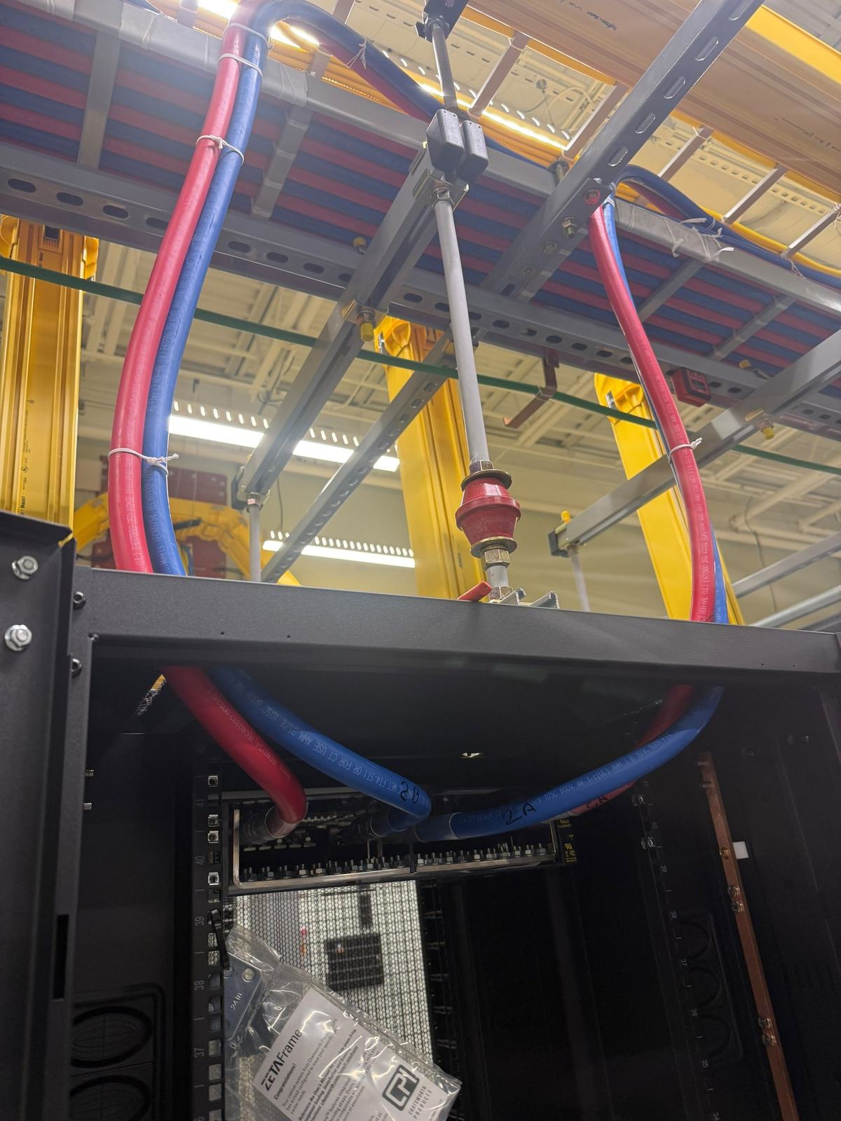 DC power feeders landed at the top of a server rack