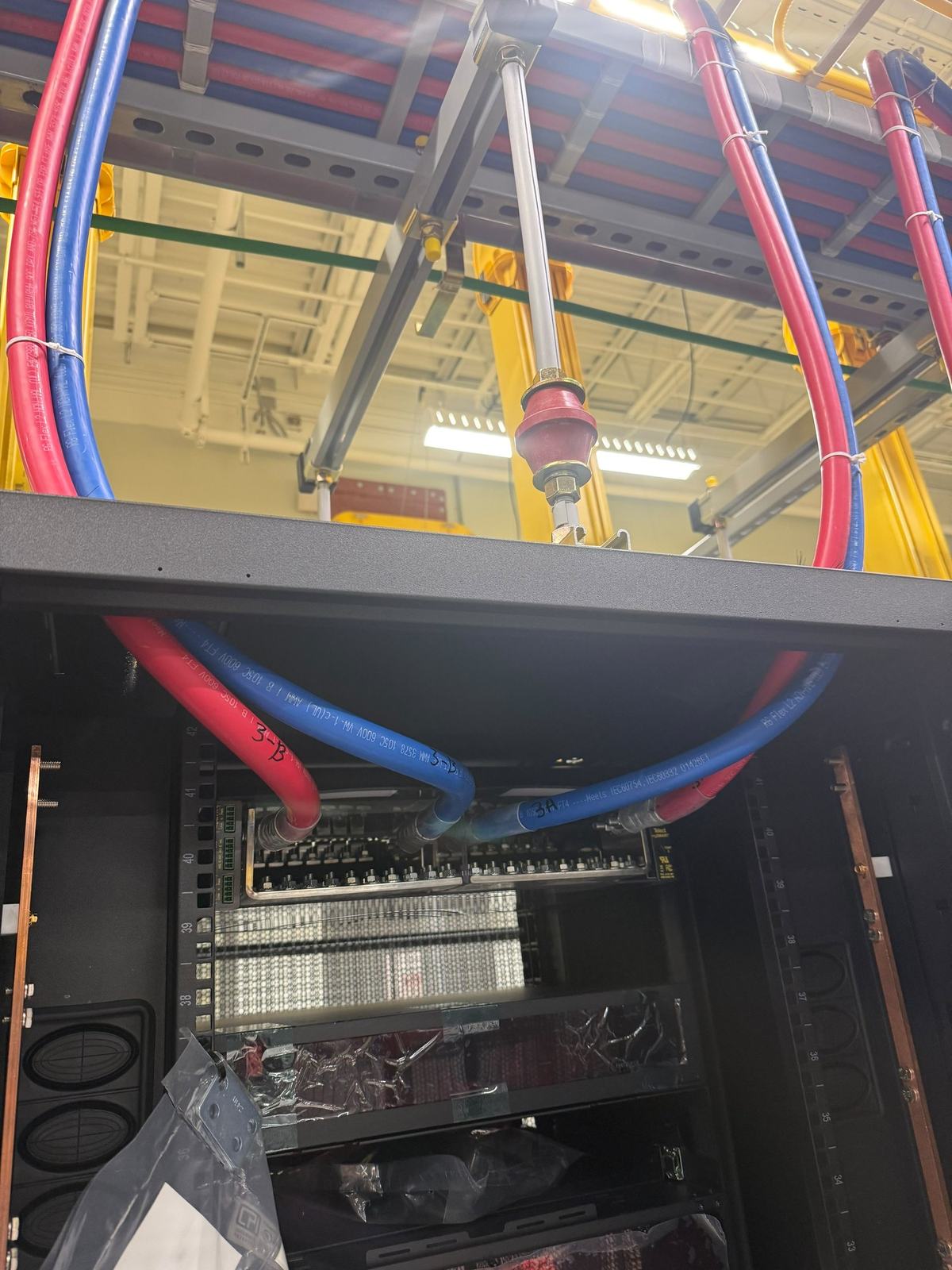 Red and blue DC feeders terminated on a copper busbar