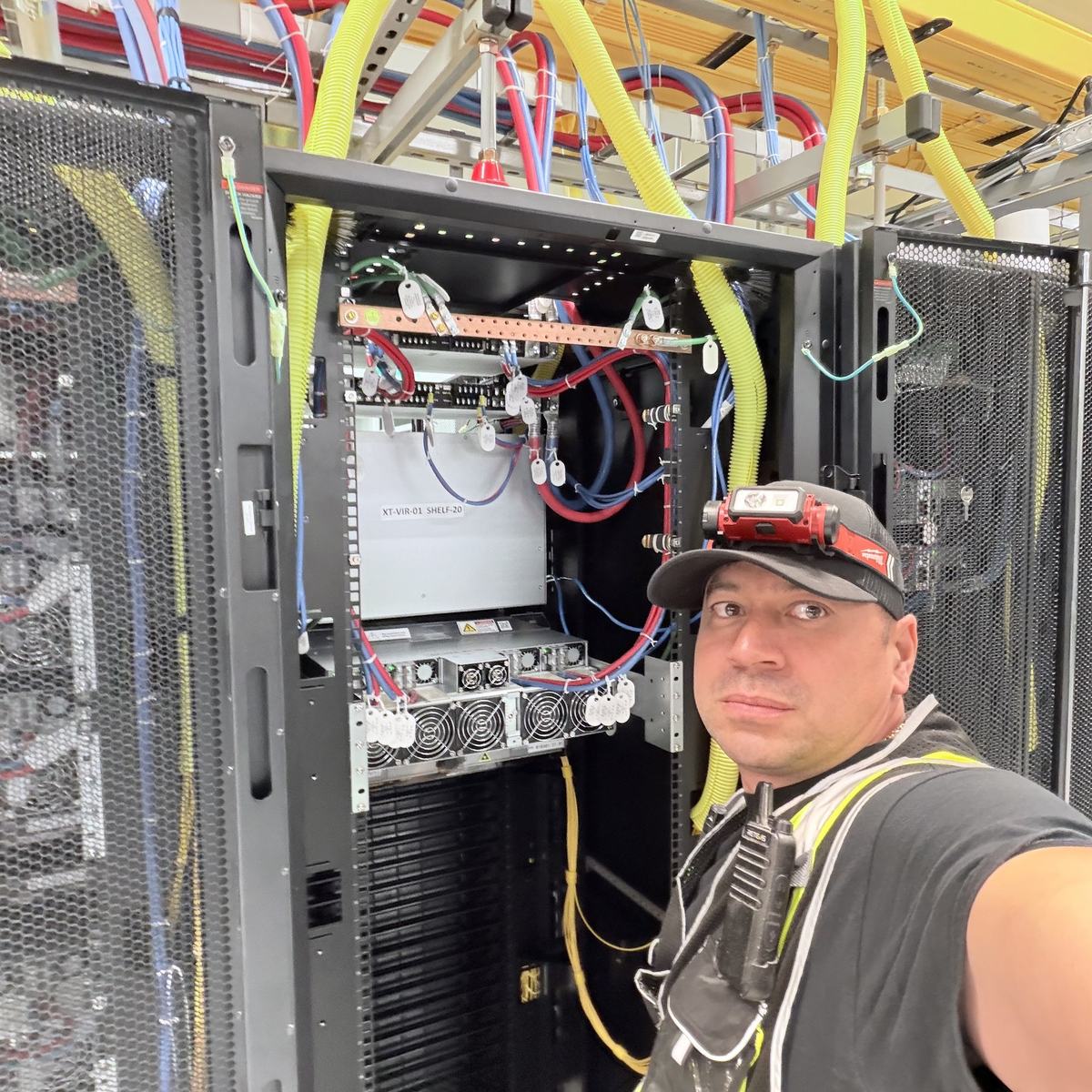 Field technician completing DC panel wiring work